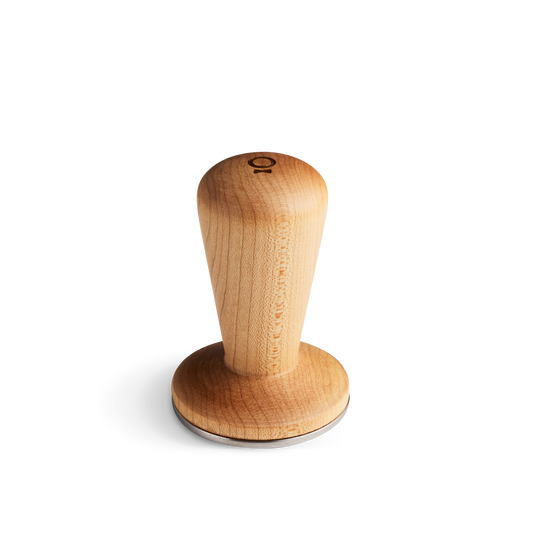 The Fellow Series 1 Tamper in Maple fits 58 mm portafilters and has a metal base.