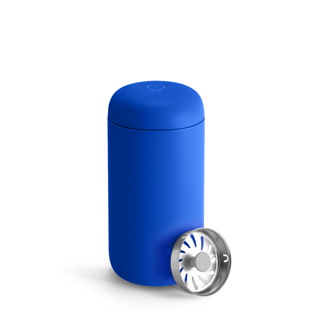 An Electric Cobalt Fellow Carter Move Mug sits next to a cylindrical metal infuser.